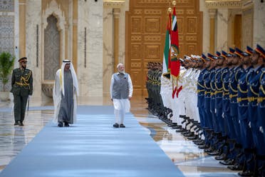 UAE President Sheikh Mohamed bin Zayed Al Nahyan and Indian Prime Minister Narendra Modi inspect the UAE Honour Guard during an official visit reception at Qasr Al Watan, Abu Dhabi, UAE, July 15, 2023. (Reuters)