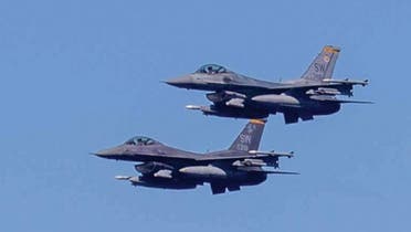 Two US Air Force F-16 Fighting Falcons operate with guided-missile destroyer USS Nitze (DDG 94) in the Red Sea. (File Photo: US Fifth Fleet)