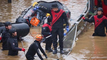 Rescue workers take part in a search and rescue operation near an underpass that has been submerged by a flooded river caused by torrential rain in Cheongju, South Korea, on July 16, 2023. (Reuters)
