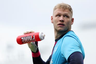 English footballer Aaron Ramsdale holds a can of Prime drink during a match