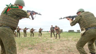 A fighter from Russian Wagner mercenary group conducts training for Belarusian soldiers on a range near the town of Osipovichi, Belarus July 14, 2023 in this still image taken from video. (Reuters)