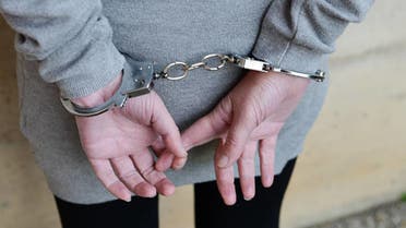Woman handcuffed. (Stock)