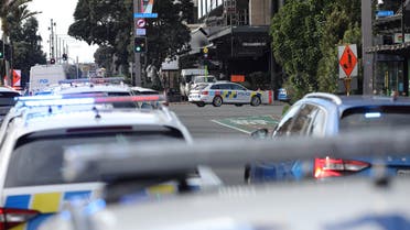 Police officers stand guard near the location of a reported shooting in Auckland, New Zealand on July 20, 2023. REUTERS/Nathan Frandino