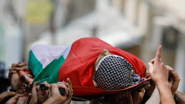 SENSITIVE MATERIAL. THIS IMAGE MAY OFFEND OR DISTURB Mourners carry the body of Palestinian militant Khalil Al-Anis who was killed in an Israeli raid, during his funeral in Al-Ain refugee camp in Nablus, in the Israeli-occupied West Bank, June 15, 2023. REUTERS/Raneen Sawafta