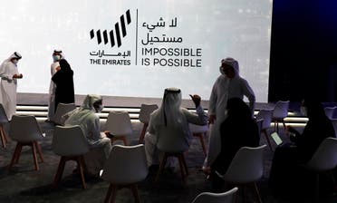 Emiratis talk before an event announcing new economic programs in the United Arab Emirates in Dubai, United Arab Emirates, Sunday, Sept. 5, 2021. (File photo: AP)