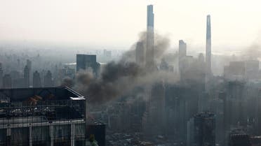 Smoke is visible after a construction crane caught fire on a high-rise building in Manhattan, New York City, US, July 26, 2023. (Reuters)