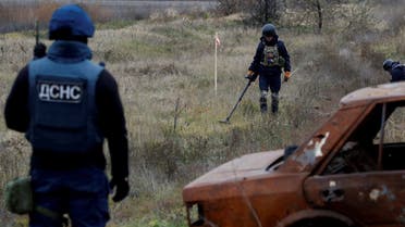 Ukrainian mine experts scan for unexploded ordnance and landmines by the main road to Kherson, Ukraine November 16, 2022. (Reuters)