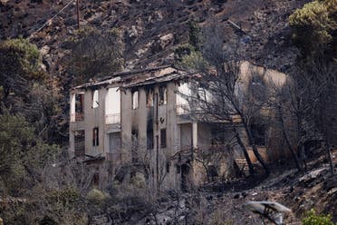 A burnt house is seen following a wildfire in the Sicilian village of Romitello, near Palermo, Italy, July 25, 2023. (Reuters)