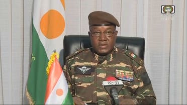 This video frame grab image obtained by AFP from ORTN - Télé Sahel on July 28, 2023 shows General Abdourahamane Tchiani, Niger’s new strongman, speaking on national television and reads a statement as President of the National Council for the Safeguarding of the Fatherland, after the ouster of President-elect Mohamed Bazoum. The chief of the Presidential Guard justifies the coup by evoking the continued deterioration of the security situation in the country, as well as poor economic and social governance. (Photo by ORTN - Télé Sahel / AFP)