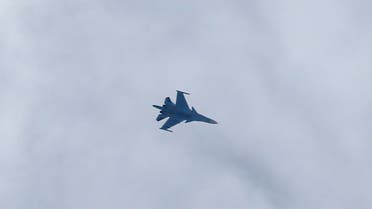 CORRECTION / A picture taken on February 20, 2018 shows a Russian air force Sukhoi Su-34 fighter jet flying over the sky in the rebel-held town of Arbin, in the besieged Eastern Ghouta region on the outskirts of the capital Damascus. (Photo by ABDULMONAM EASSA / AFP)