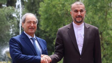 Iran’s Foreign Minister Hossein Amir-Abdollahian (R) welcomes his Syrian counterpart Faisal Mekdad in Tehran on July 31, 2023. (AFP)