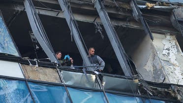 Members of security services investigate a damaged office building in the Moscow City following a reported Ukrainian drone attack in Moscow Russia, August 1, 2023. (Reuters)
