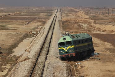 A picture taken on November 12 2018 shows a derailed train left on the side of the rail track in Iraq's desertic western province of Anbar, along the the porous frontier with neighbouring war-torn Syria. (File photo: AFP)