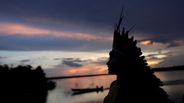 Indigenous leader of the Celia Xakriaba tribe walks next to the Xingu River during a four-day pow wow in Piaracu village, in Xingu Indigenous Park, near Sao Jose do Xingu, Mato Grosso state, Brazil, January 15, 2020. REUTERS/Ricardo Moraes