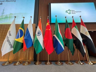 Flags are seen displayed at the opening ceremony of the New Development Bank Eighth Annual Meeting in Shanghai on May 30, 2023. (File photo: AFP)
