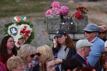 Fans of Sinead O'Connor line the street as her funeral cortege passes through her former hometown of Bray, Co Wicklow, Ireland, Tuesday, Aug. 8, 2023. (AP)