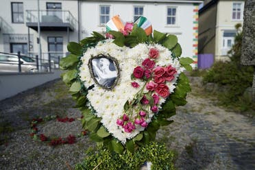 Floral tributes left outside the former home of Sinead O'Connor ahead of the late singer's funeral, in Bray, Co Wicklow, Ireland, Tuesday, Aug. 8, 2023. (AP)