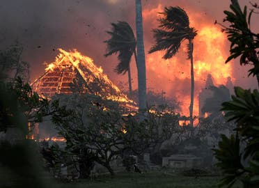 The hall of historic Waiola Church in Lahaina and nearby Lahaina Hongwanji Mission are engulfed in flames along Wainee Street on Tuesday, Aug. 8, 2023, in Lahaina, Hawaii. (AP)