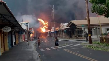 The hall of historic Waiola Church in Lahaina and nearby Lahaina Hongwanji Mission are engulfed in flames along Wainee Street on Tuesday, Aug. 8, 2023, in Lahaina, Hawaii. (Matthew Thayer/The Maui News via AP)