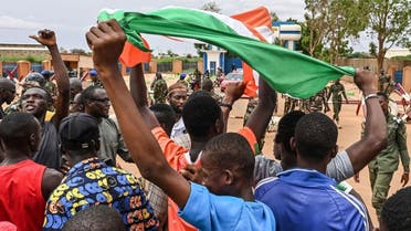 Supporters of Niger's National Council for the Safeguard of the Homeland (CNSP) gather for a demonstration in Niamey on August 11, 2023 near a French airbase in Niger. (AFP)