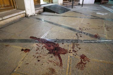 Blood stains the floor at the site of a shooting attack at Iran's Shah Cheragh mausoleum in the Fars province capital Shiraz, on August 13, 2023 (AFP)