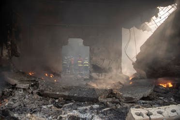 Firefighters put out a fire after a powerful explosion in San Cristobal, Dominican Republic, Monday, Aug 14, 2023. (AP)