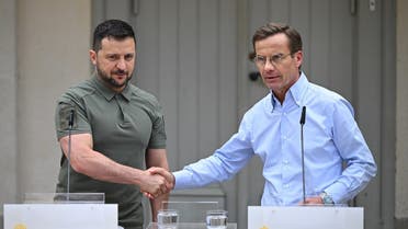 Ukrainian President Volodymyr Zelenskyy (L) and Swedish Prime Minister Ulf Kristersson shake hands following a joint press conference after talks at the minister’s countryside retreat in Harpsund, south-west of Stockholm, Sweden on August 19, 2023. (AFP)