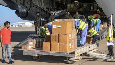 Humanitarian aid packages provided by India to Sudan are unloaded off of an Indian Air Force military transport aircraft on the tarmac at Port Sudan airport on May 18, 2023. (Photo by AFP)