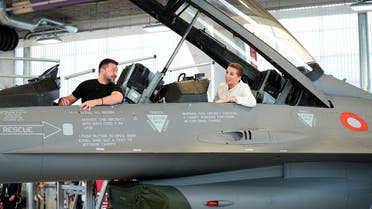 Ukrainian President Volodymyr Zelenskiy and Denmark's Prime Minister Mette Frederiksen sit in a F-16 fighter jet at Skrydstrup Airbase in Vojens, Denmark, August 20, 2023. (Reuters)