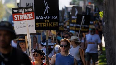 AG-AFTRA actors and Writers Guild of America (WGA) writers walk the picket line outside Disney Studios in Burbank, California, U.S., July 25, 2023.  (Reuters)
