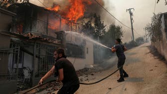Greece struggles to control wildfires as death toll rises to 20 