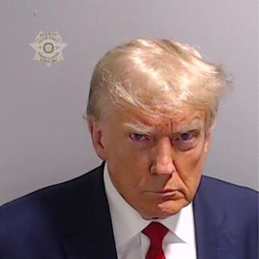 Former US President Donald Trump is shown in a police booking mugshot released by the Fulton County Sheriff's Office, after a Grand Jury brought back indictments against him and 18 of his allies in their attempt to overturn the state's 2020 election results in Atlanta, Georgia, US, August 24, 2023. (Reuters)