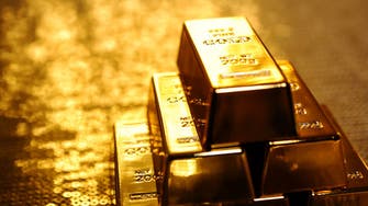 Gold holds gains as Treasuries rally on US rate cut optimism, up 14 pct this year