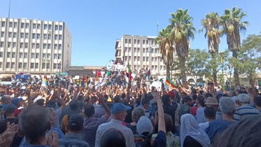 People protest against the latest decisions by Syrian government on increasing the prices of fuels in Sweida, Syria, August 24, 2023 in this picture obtained from social media. (Sweida 24 via Reuters)