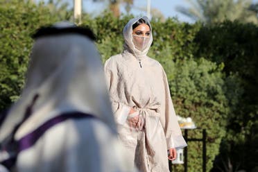 A Saudi model displays latest collection of abayas (Arabic female dresses) by Saudi Princess Safia Hussain, during a fashion show in Riyadh, Saudi Arabia, January 23, 2021. (Reuters)