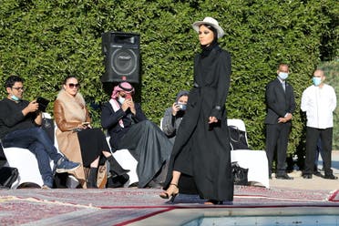 Saudi Princess Hana bint Khalid bin Saud Al-Faisal, a model, displays latest collection of abayas (Arabic female dresses) by Saudi Princess Safia Hussain, during a fashion show in Riyadh, Saudi Arabia January 23, 2021. (Reuters)