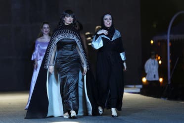 American fashion designer, Amina Ja'arah, walks on the catwalk during the Jimmy Fashion show, where local and international fashion designers launched their collections, in Riyadh, Saudi Arabia, August 25, 2022. (Reuters)