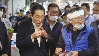  Japanese PM eats Fukushima fish after row over radioactive wastewater release