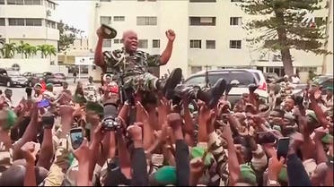 This video grab shows soldiers holding General Brice Clothaire Oligui Nguema aloft in Libreville, Gabon, on August 30, 2023. (AP)