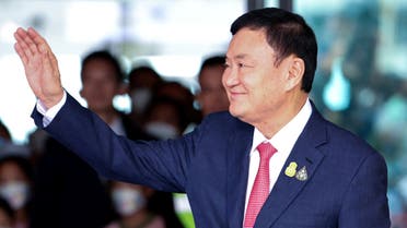 Former Thai Prime Minister Thaksin Shinawatra, who is expected to be arrested upon his return as he ends almost two decades of self-imposed exile, waves at Don Mueang airport in Bangkok, Thailand August 22, 2023. (Reuters)