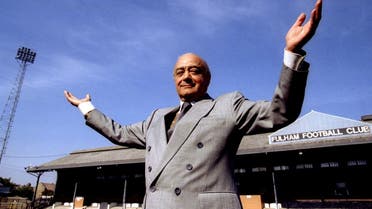 Mohamed Al-Fayed stands in front of the east stand of Craven Cottage, home of Fulham Football Club, on May 29, 1997. (Reuters) 