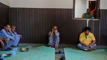 Patients sit inside a room used as a dining area at a mental health hospital in Srinagar, Indian controlled Kashmir, Tuesday, Aug 1, 2023. (AP)