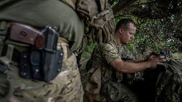 A Ukrainian serviceman operates an FPV drone from his positions at a front line, as Russia’s attack on Ukraine continues, near the village of Robotyne, Zaporizhzhia region, Ukraine, August 25, 2023. (Reuters)