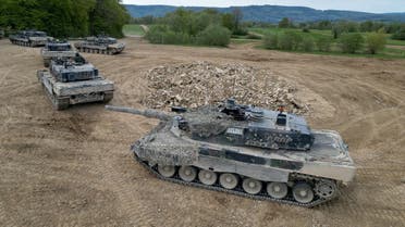 Recruits of the Swiss army Tank School 21 perform an attack exercise with the Leopard 2 tanks in Bure, Switzerland, May 5, 2023. (Reuters)