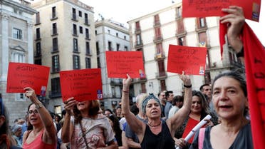 Women hold placards, depicting red card in football, that read “Stop Violence against Women” during a protest against Royal Spanish Football Federation President Luis Rubiales and in support of the player Jenni Hermoso at Sant Jaume Square in Barcelona, Spain, on September 4, 2023. (Reuters)