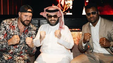 Tyson Fury, Turki al-Sheikh, and Francis Ngannou pose for a picture. (Twitter)
