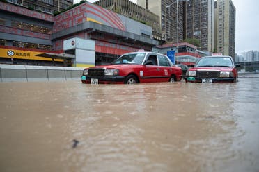 Stranded taxis are pictured on a flooded road in Hong Kong on September 8, 2023. (AFP)