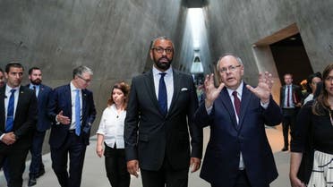 Britain's Secretary of State for Foreign, Commonwealth and Development Affairs, James Cleverly, center left, listens to Dani Dayan, Chairman of Yad Vashem during a visit in the Yad Vashem World Holocaust Remembrance Center in Jerusalem, Monday, Sept. 11, 2023. (AP)