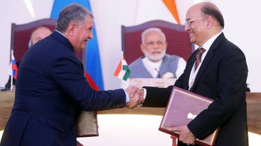 Igor Sechin (L), chief executive of Russia's top oil producer Rosneft, and Narendra Verma, managing director of ONGC Videsh Limited (OVL), attend an exchange of agreements event after the India-Russia Annual Summit in Benaulim, in the western state of Goa, India, on October 15, 2016. (Reuters)
