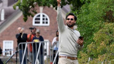 Protestor Salwan Momika, who planned to burn a copy of Koran and the Iraqi flag, waves a Swedish flag outside the Iraqi embassy, in Stockholm, Sweden July 20, 2023. (Reuters)
